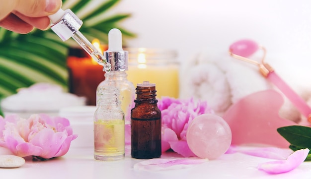 Pink flowers on white background spa facial Selective focus