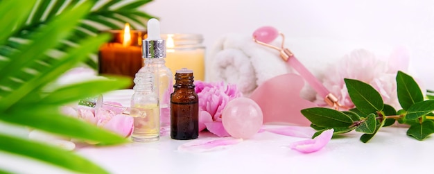 Pink flowers on white background spa facial Selective focus