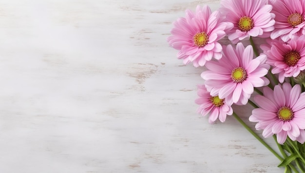 Pink flowers on a white marble background