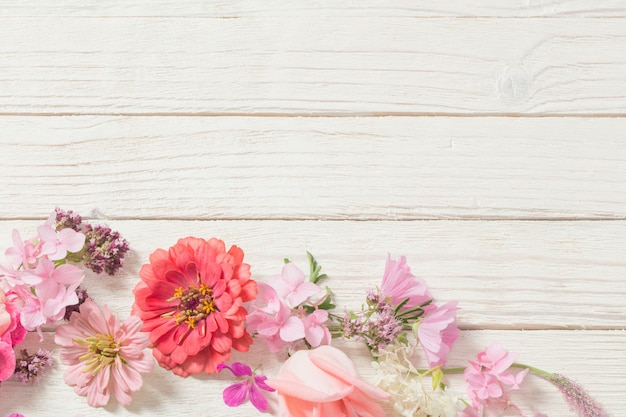 Pink flowers on white wood