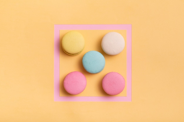 Photo pink frame with colorful macaroons