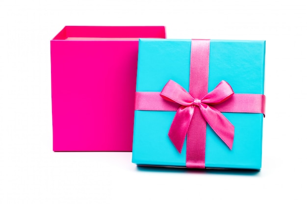 Pink gift box with ribbon isolated on white background