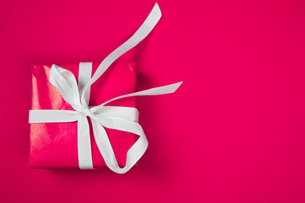 Pink gift on pink background. High quality photo