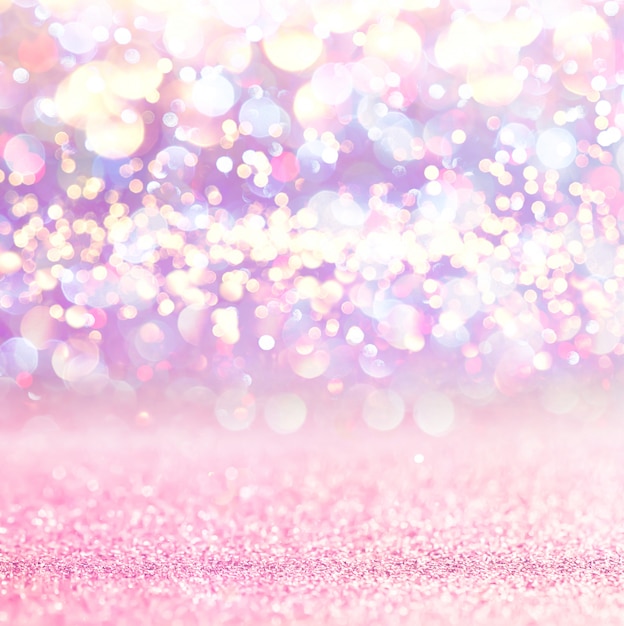 Pink glitter lights bokeh background. defocused