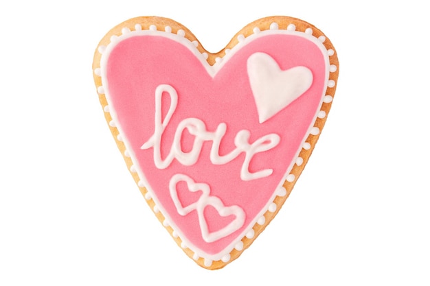 Pink heart cookie with text love and icing isolated on white, flat lay. Romantic pastry for valentine day.