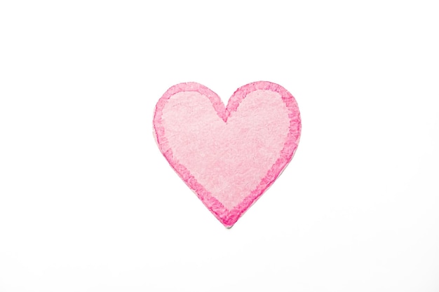 Photo pink heart paper cutout on white background