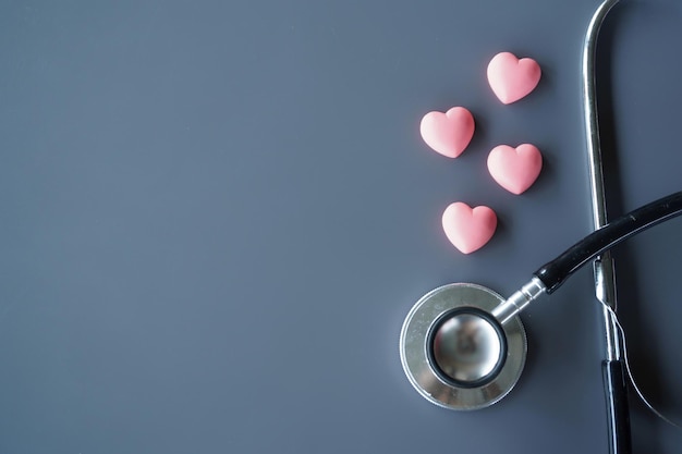 Pink hearts and stethoscope with copy space for text