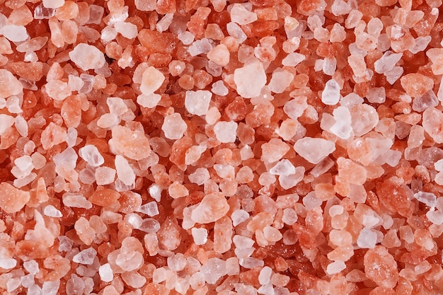 Pink himalayan salt isolated on white background.