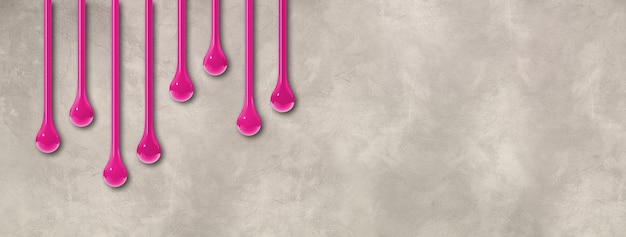 Pink ink drops on light concrete wall Horizontal banner