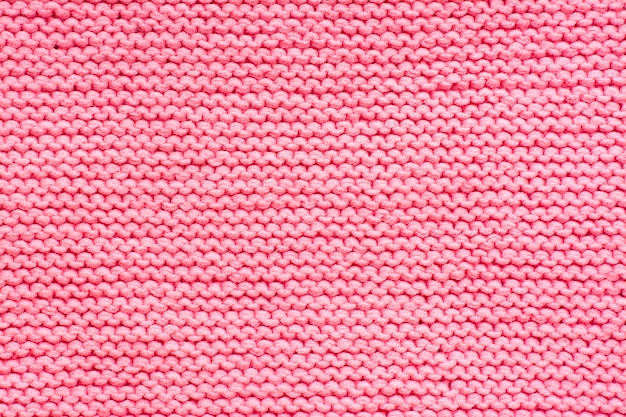 Pink knitted fabric texture background