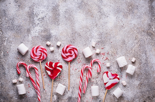 Pink lollipop, candy cane and marshmallow 