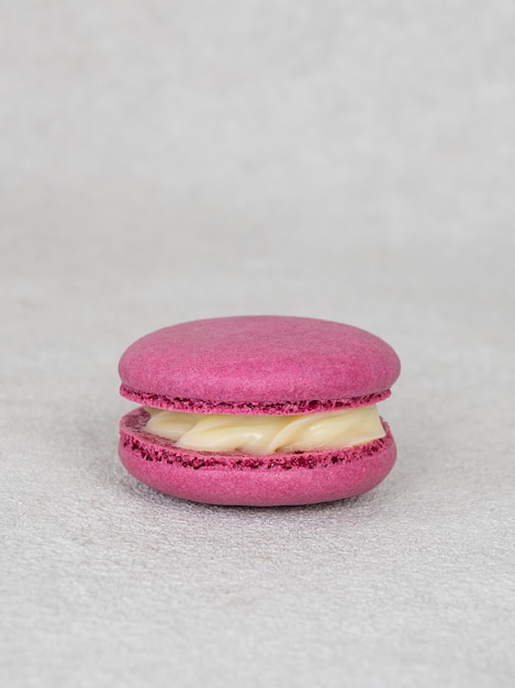 Pink macaron with curdled white cream