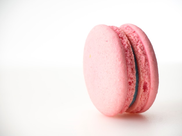 Pink macaroon on white background