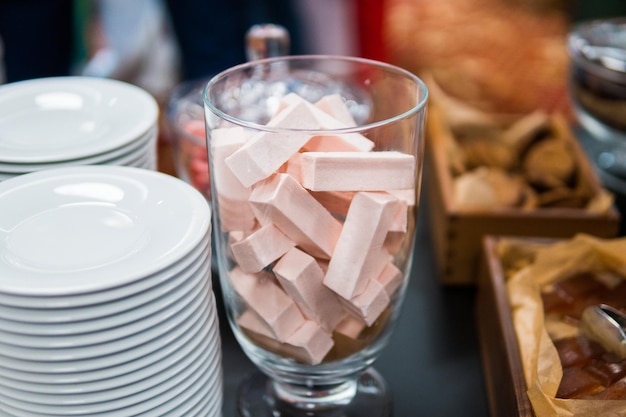 Pink marmalade in glassware and other sweets on the buffet table during the coffee break