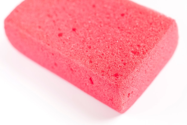 Pink micro sponge for cleaning and washing a car on a white background