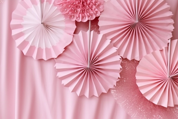 Pink paper flowers and a pink paper flower backdrop