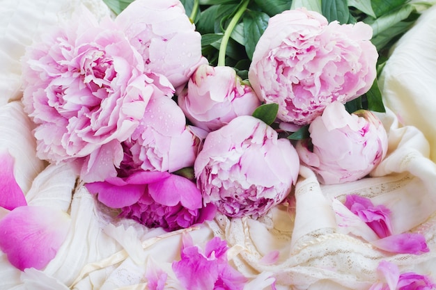 Pink peonies and white wedding dress, retro vintage style