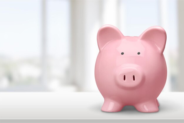 Pink piggy bank on  background