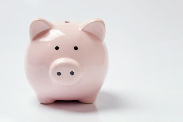 Pink piggy bank isolated on white background