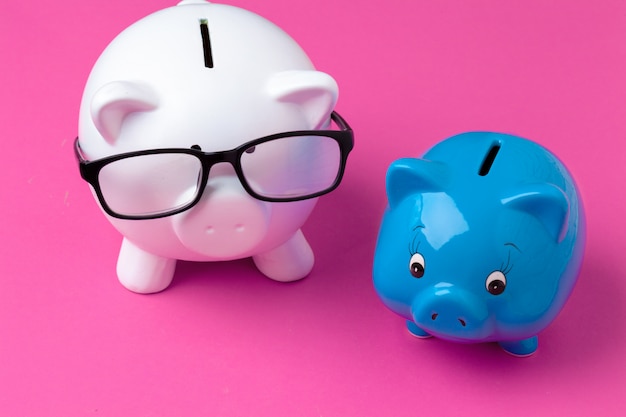 Pink piggy bank with glasses