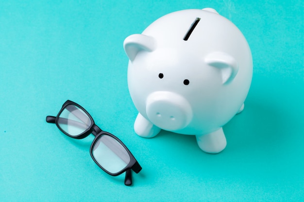 Pink piggy bank with glasses