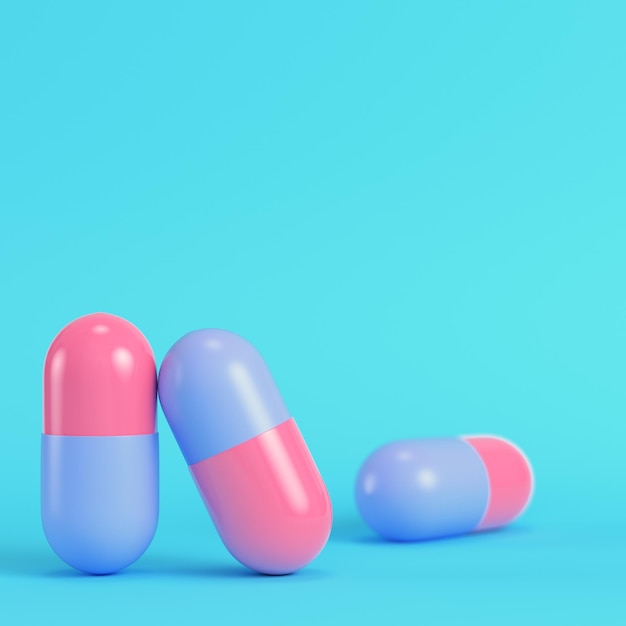 Pink pills on bright blue background in pastel colors Minimalism concept