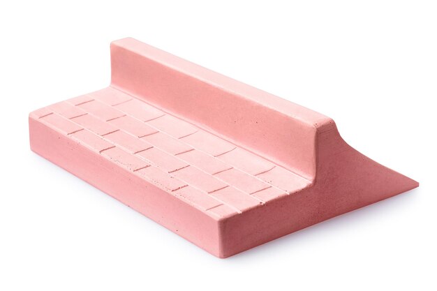 Pink plaster ramp with two sides for fingerboarding isolated on a white background