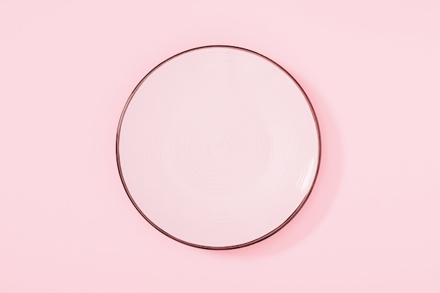 Pink plate on pink Flat lay top view copy space