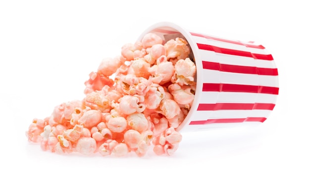 pink Popcorn in striped bucket isolated on white background