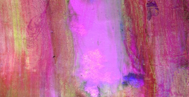 A pink and purple painting of a woman's face.