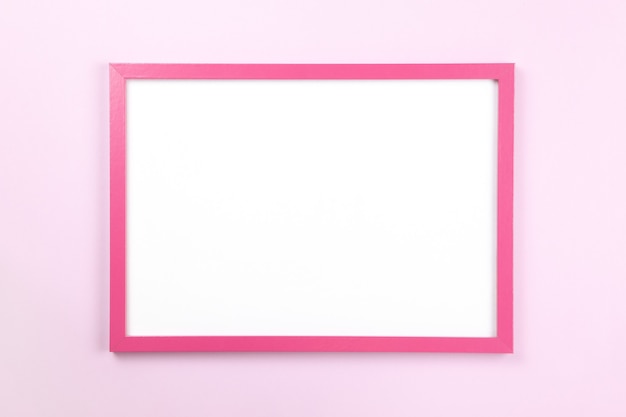 Pink rectangular frame with empty clean white center on pastel pink background