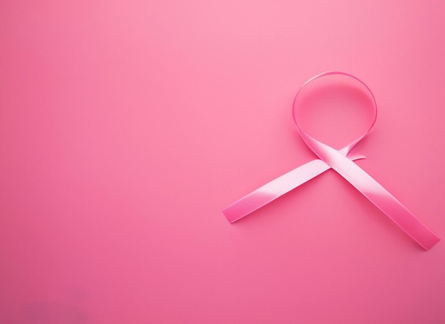 Pink ribbon on pink background