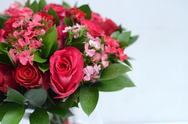 Pink rose flower arrangement on white background