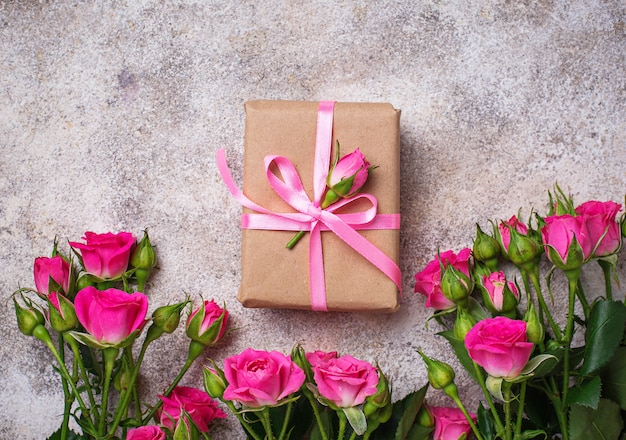 Pink roses and gift boxes with ribbons