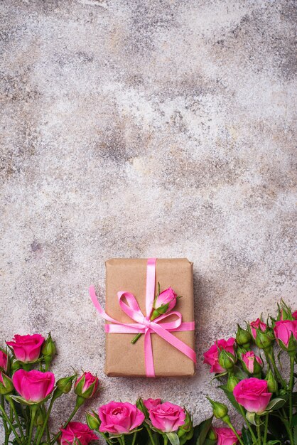 Pink roses and gift boxes with ribbons