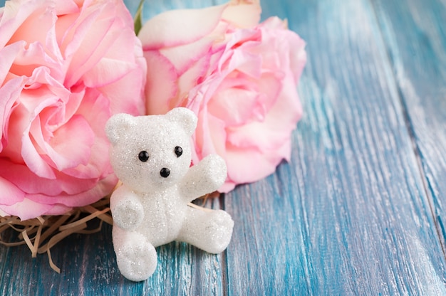 Pink roses and teddy bear