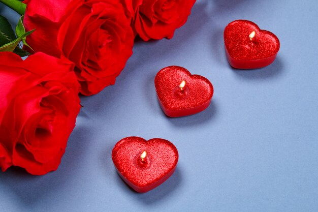 Pink roses with red candles of a heart. Template for March 8, Mother's Day