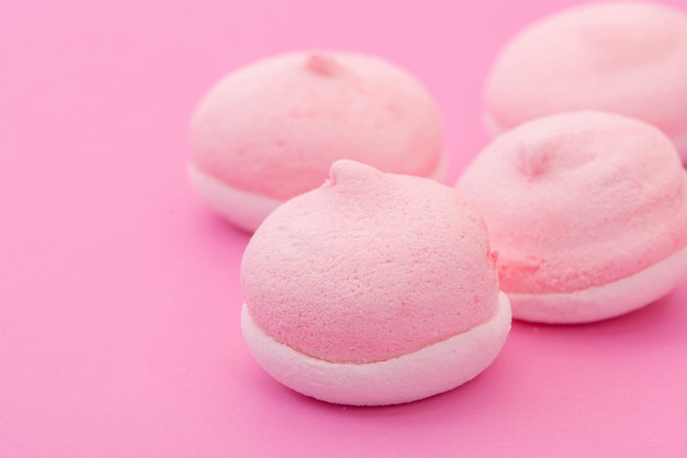 Pink round shape cookies on a pink background