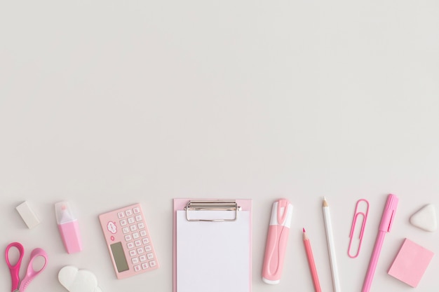 Pink school stationery on a grey background Top view Flat lay Back to school concept