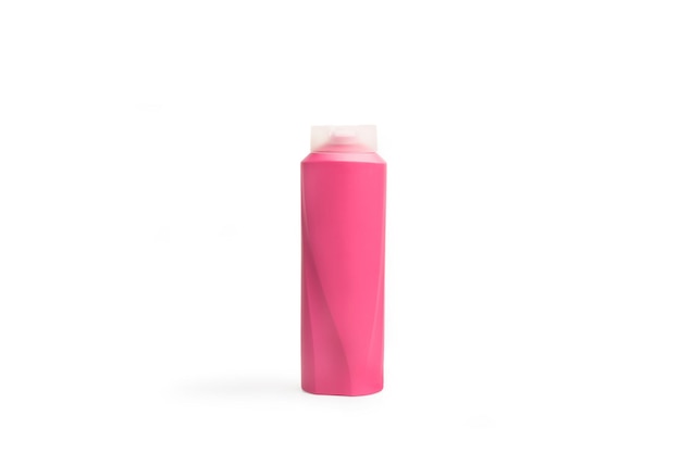 A pink shampoo bottle on a white background with copy space