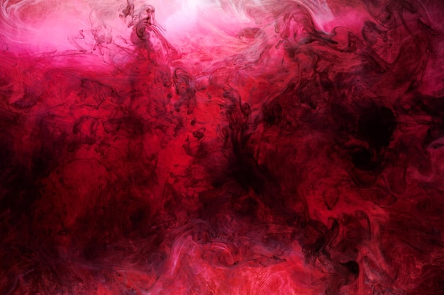 Pink smoke on black ink background, colorful fog, abstract swirling touch ocean sea, acrylic paint pigment underwater