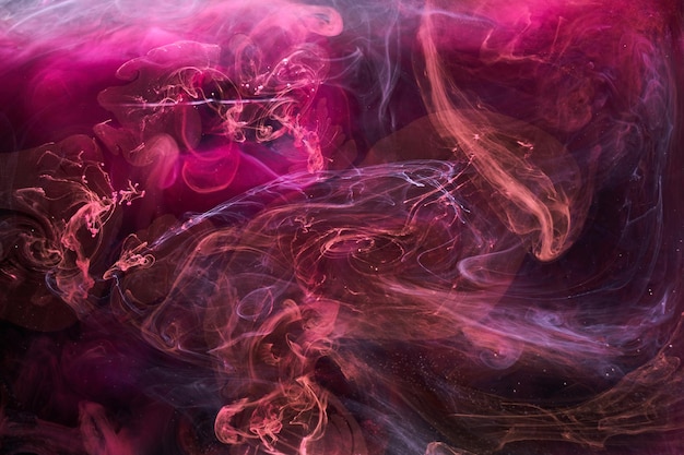 Pink smoke on black ink background, colorful fog, abstract swirling touch ocean sea, acrylic paint pigment underwater