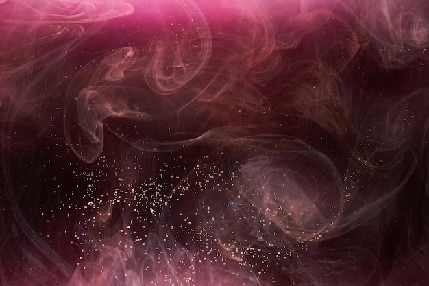 Pink smoke on black ink background, colorful fog, abstract swirling touch ocean sea, acrylic paint pigment underwater