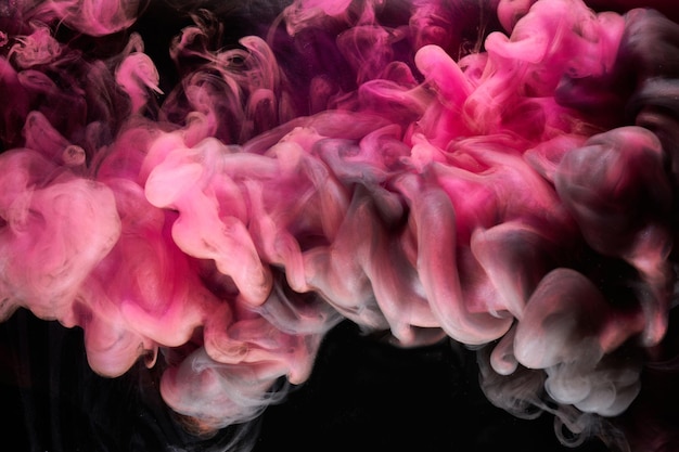 Pink smoke on black ink background, colorful fog, abstract swirling touch ocean sea, acrylic paint pigment underwater