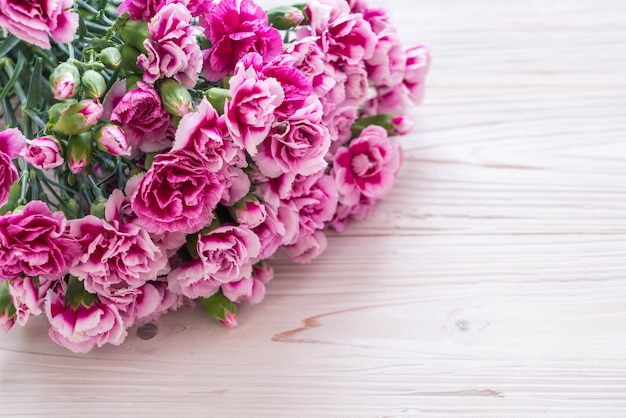 pink spring flower on wooden background