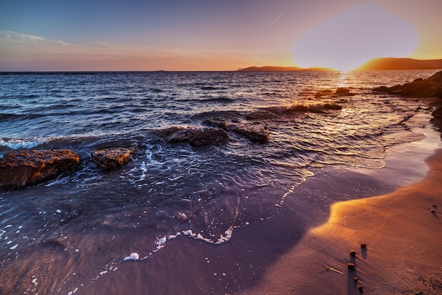 Pink sunset in Alghero shore Italy