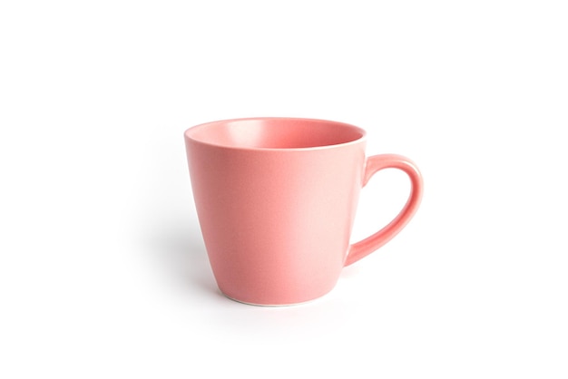 Pink tea cup for drink isolated on white background. Ceramic coffee cup or mug close up. High quality photo