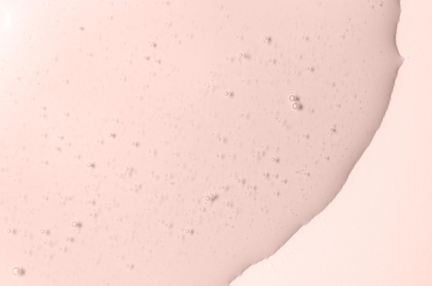 Pink texture of cosmetic gel to moisturize the skin Copy space