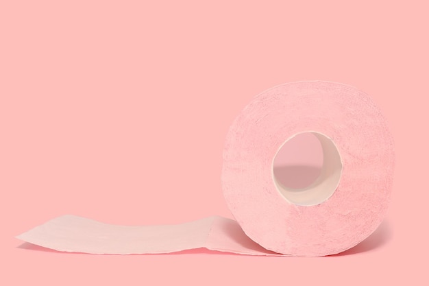 Pink toilet paper on a pink background Health and hygiene every day Closeup