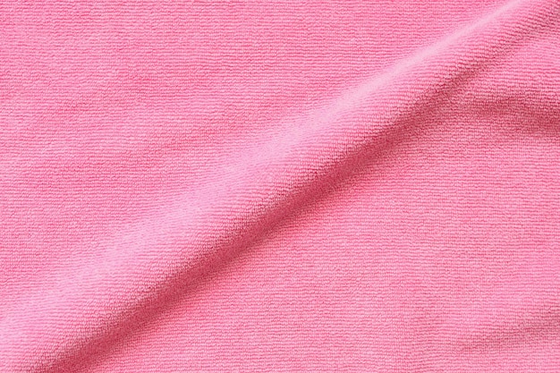 Pink towel fabric texture surface close up background